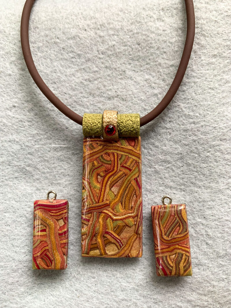 Unique Jewelry set featuring Maroon, Taupe, Mustard, and Olive Green pendant and Earring set with red Swarovski crystal