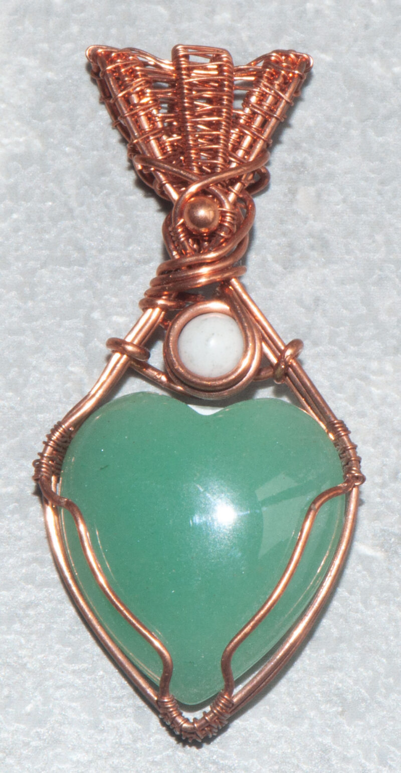 Beautiful green aventurine heart shaped pendant wrapped in tarnish resistant copper wire.