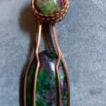 Two ruby in zoisite stones wrapped in copper wire